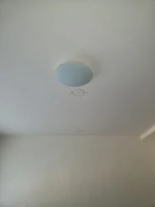 Retained ceiling sections put back after routing the replacement lighting cable