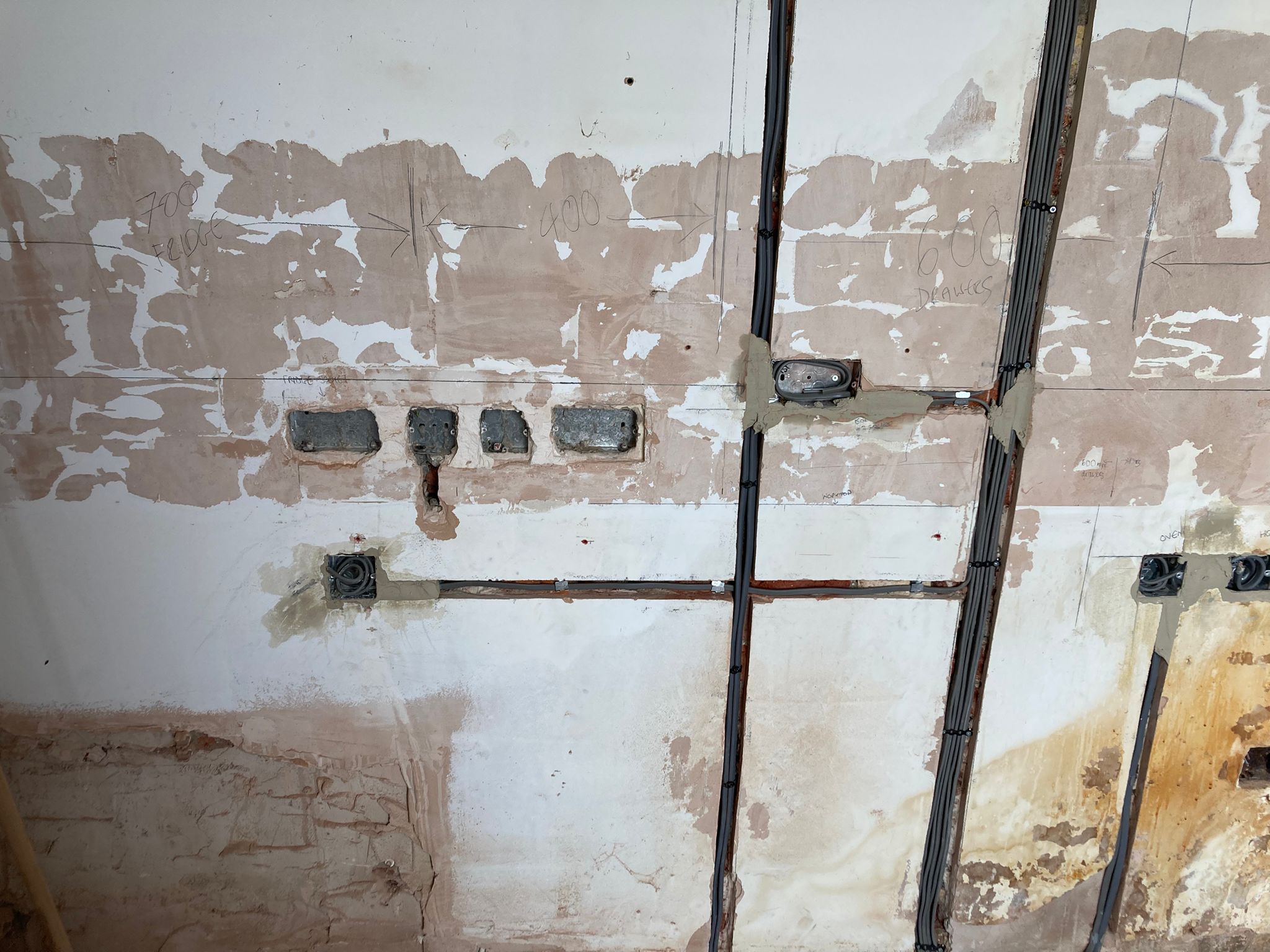 Chased wall and cable routes during a genuine electrical rewire